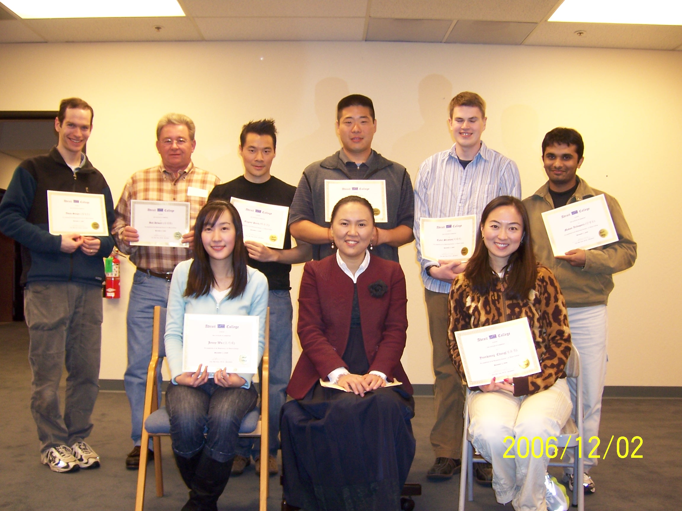 Group of students with certificates of completion
